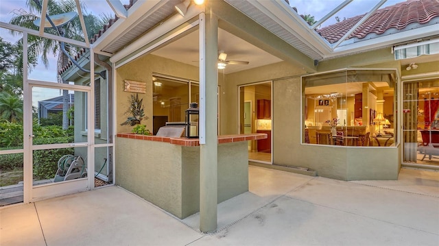 7012 Treymore Ct, Sarasota, FL 34243 - unfurnished sunroom featuring plenty of natural light and ceiling fan