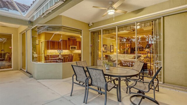 7012 Treymore Ct, Sarasota, FL 34243 - view of patio featuring ceiling fan and outdoor dining area