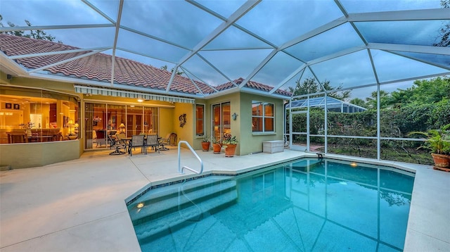 7012 Treymore Ct, Sarasota, FL 34243 - outdoor pool with a patio area, outdoor dining space, and glass enclosure