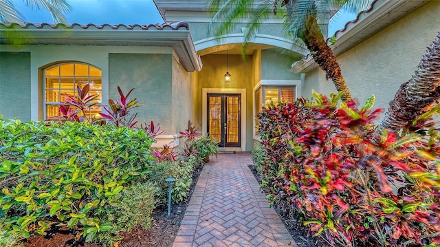 7012 Treymore Ct, Sarasota, FL 34243 - property entrance featuring french doors and stucco siding