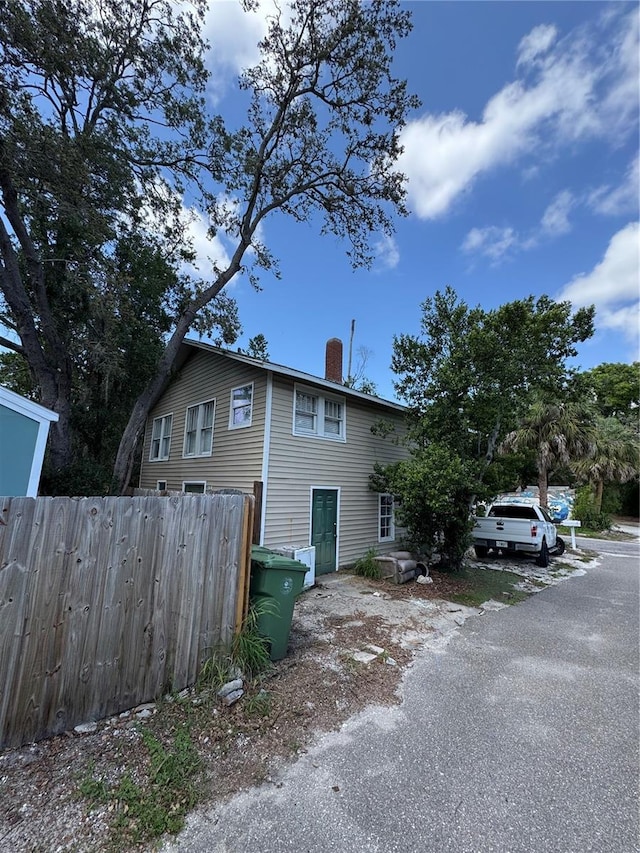 610 21st St W, Bradenton, FL 34205 - view of home's exterior featuring a chimney