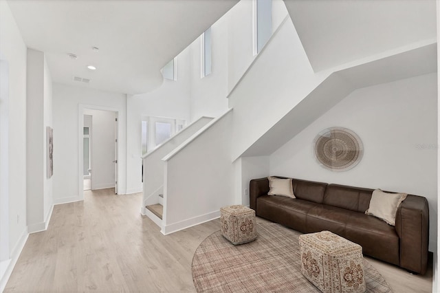 6028 Red Mangrove Ln, Bradenton, FL 34210 - living room featuring stairway, light wood-type flooring, and recessed lighting