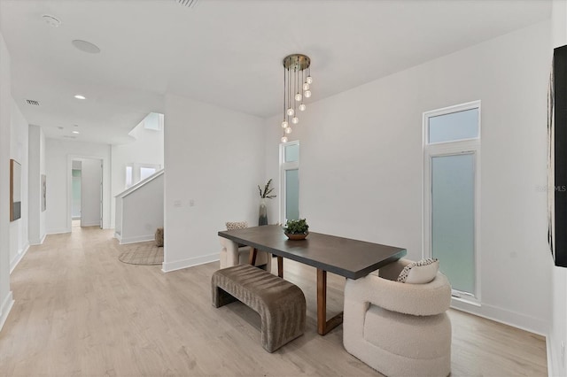 6028 Red Mangrove Ln, Bradenton, FL 34210 - dining space featuring light wood-style floors, stairway, and recessed lighting