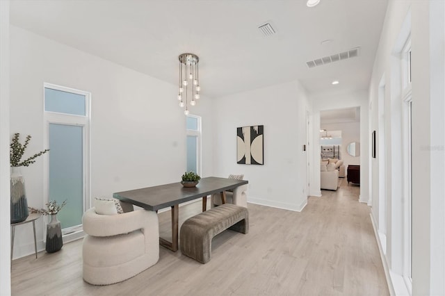 6028 Red Mangrove Ln, Bradenton, FL 34210 - dining space featuring light wood-style flooring and recessed lighting