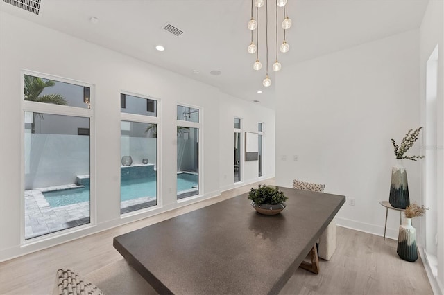 6028 Red Mangrove Ln, Bradenton, FL 34210 - dining space with wood finished floors and recessed lighting