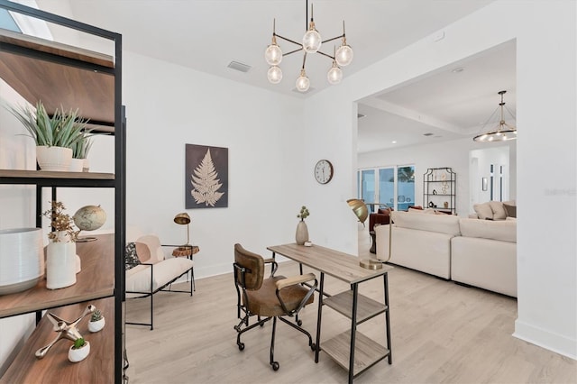 6028 Red Mangrove Ln, Bradenton, FL 34210 - office area with wood finished floors and a chandelier