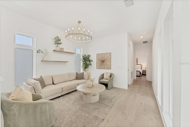6028 Red Mangrove Ln, Bradenton, FL 34210 - living area with light wood finished floors, a chandelier, and recessed lighting