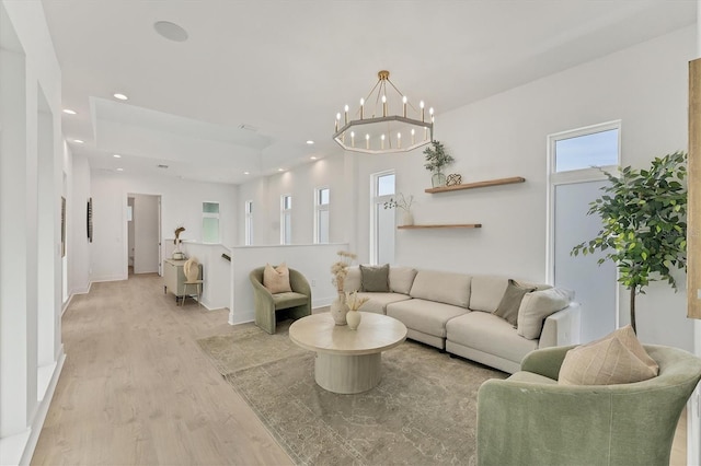 6028 Red Mangrove Ln, Bradenton, FL 34210 - living room with light wood-style flooring, a chandelier, and recessed lighting