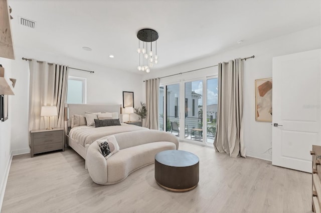 6028 Red Mangrove Ln, Bradenton, FL 34210 - bedroom featuring access to outside, light wood-type flooring, multiple windows, a chandelier, and recessed lighting