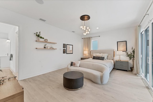 6028 Red Mangrove Ln, Bradenton, FL 34210 - bedroom with light wood-type flooring and access to outside