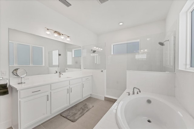6028 Red Mangrove Ln, Bradenton, FL 34210 - full bath featuring a garden tub, vanity, a walk in shower, and tile patterned floors