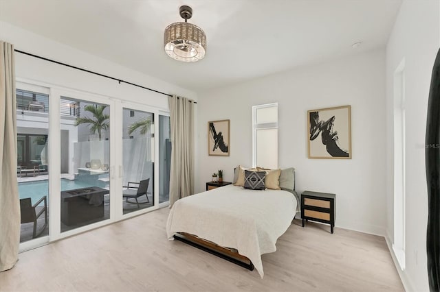 6028 Red Mangrove Ln, Bradenton, FL 34210 - bedroom featuring access to outside and wood finished floors