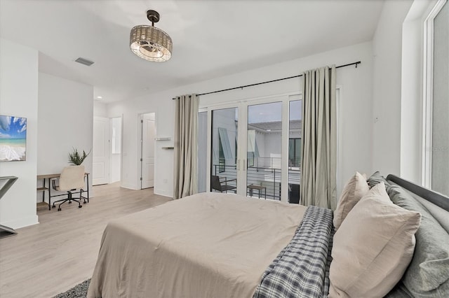 6028 Red Mangrove Ln, Bradenton, FL 34210 - bedroom featuring access to exterior and light wood finished floors