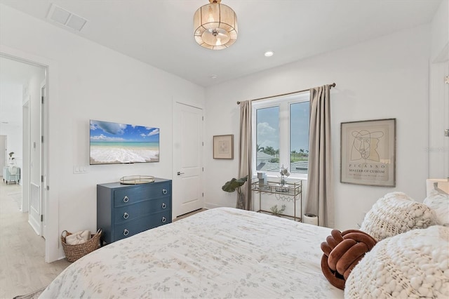 6028 Red Mangrove Ln, Bradenton, FL 34210 - bedroom with wood finished floors and access to outside