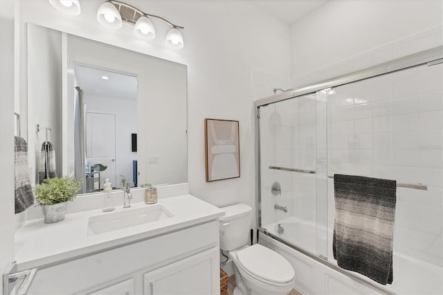 6028 Red Mangrove Ln, Bradenton, FL 34210 - bathroom featuring vanity and bath / shower combo with glass door