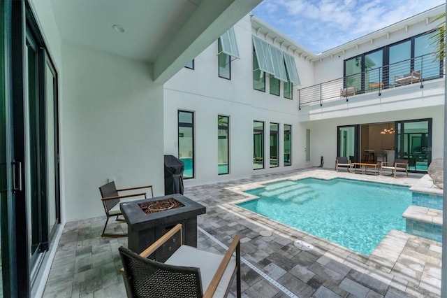 6028 Red Mangrove Ln, Bradenton, FL 34210 - outdoor pool featuring an outdoor fire pit, a patio area, and grilling area