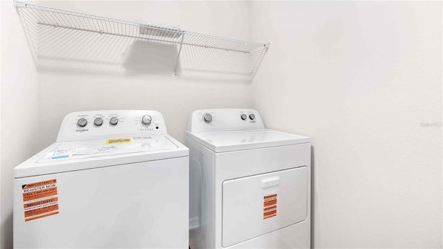 12071 Mountain Island Trl, Parrish, FL 34219 - laundry area with washing machine and dryer