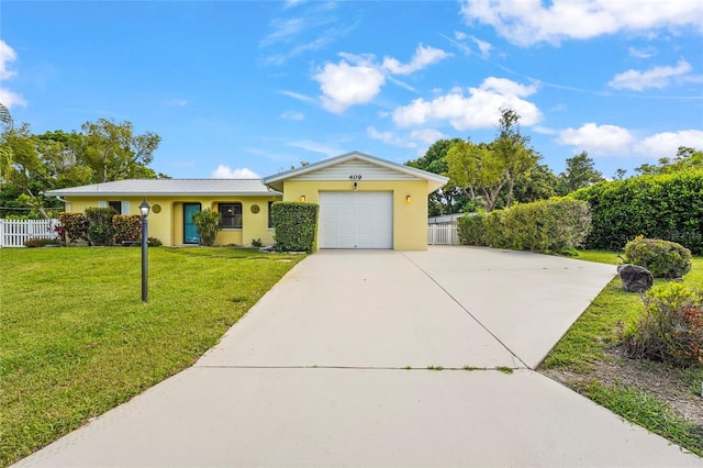 409 Archibald Ave, Sarasota, FL 34243 - single story home featuring concrete driveway, a garage, stucco siding, and a metal roof