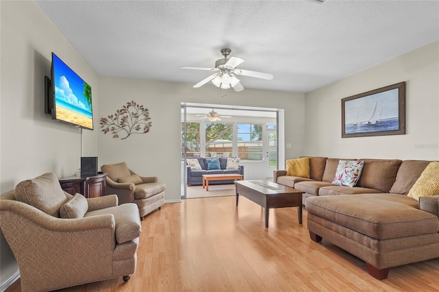 409 Archibald Ave, Sarasota, FL 34243 - living area featuring a ceiling fan, light wood finished floors, and a textured ceiling