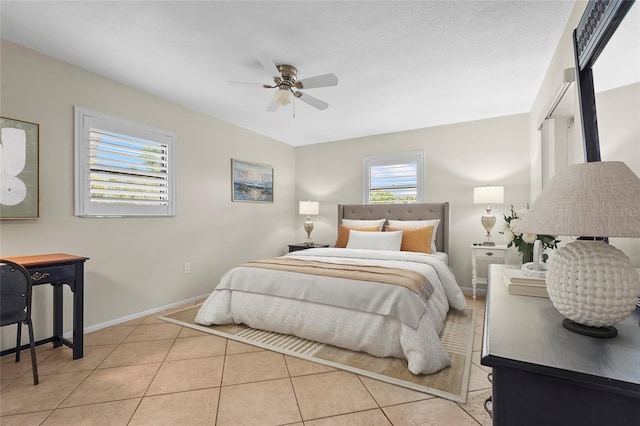 409 Archibald Ave, Sarasota, FL 34243 - bedroom with light tile patterned floors and a ceiling fan