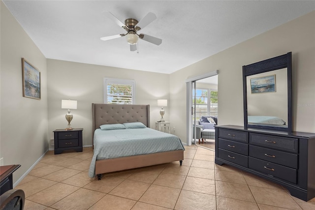 409 Archibald Ave, Sarasota, FL 34243 - bedroom featuring multiple windows, light tile patterned floors, and ceiling fan