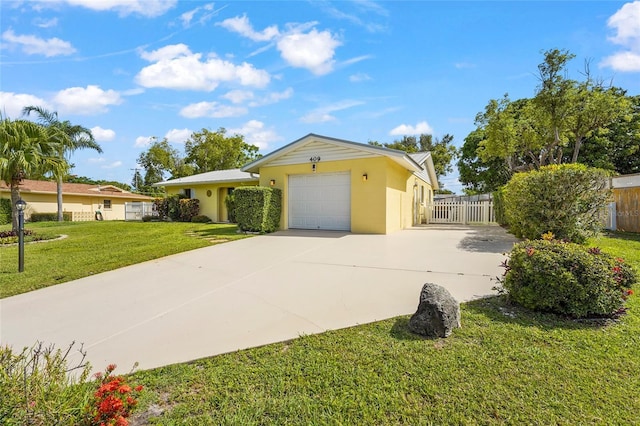 409 Archibald Ave, Sarasota, FL 34243 - ranch-style house with concrete driveway, a garage, and stucco siding