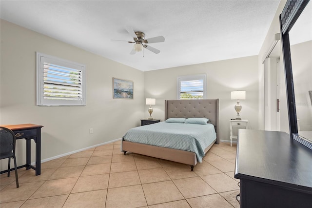 409 Archibald Ave, Sarasota, FL 34243 - bedroom with light tile patterned floors and a ceiling fan