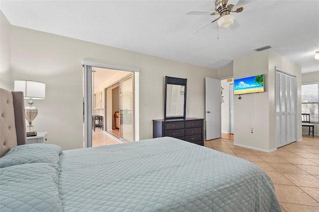 409 Archibald Ave, Sarasota, FL 34243 - bedroom with light tile patterned floors and a ceiling fan