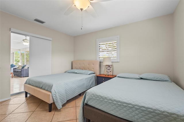 409 Archibald Ave, Sarasota, FL 34243 - bedroom featuring light tile patterned floors and ceiling fan