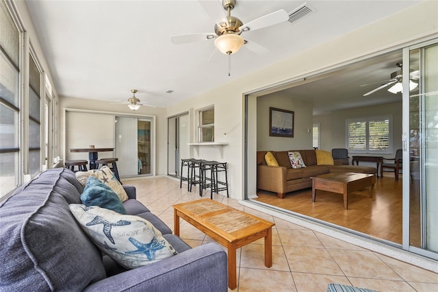 409 Archibald Ave, Sarasota, FL 34243 - living area featuring light tile patterned floors and ceiling fan