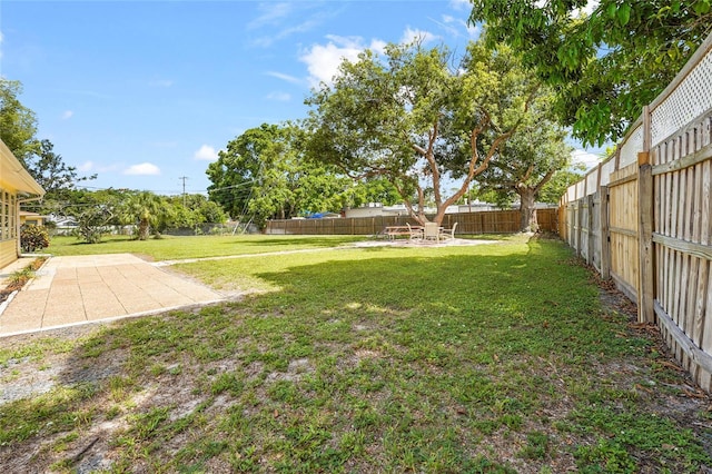 409 Archibald Ave, Sarasota, FL 34243 - fenced backyard with a patio