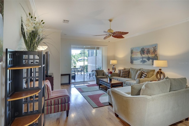 362 Fairway Isles Ln, Bradenton, FL 34212 - living area featuring ceiling fan, wood finished floors, and crown molding