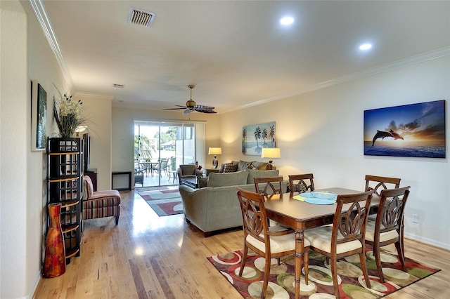 362 Fairway Isles Ln, Bradenton, FL 34212 - dining room with light wood-style floors, crown molding, ceiling fan, and recessed lighting