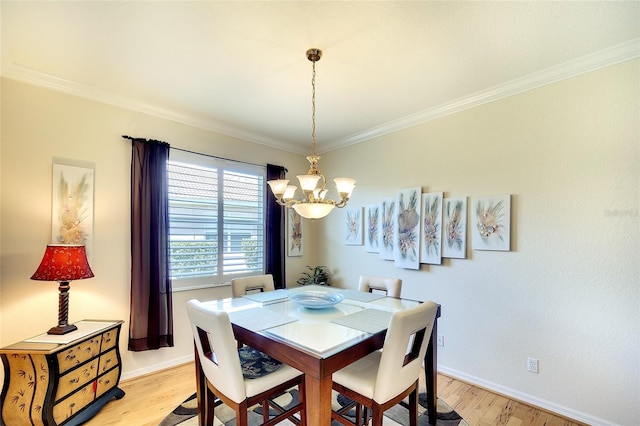 362 Fairway Isles Ln, Bradenton, FL 34212 - dining space with a chandelier, light wood-style flooring, and ornamental molding