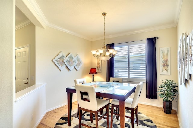 362 Fairway Isles Ln, Bradenton, FL 34212 - dining space featuring light wood finished floors, crown molding, and a chandelier