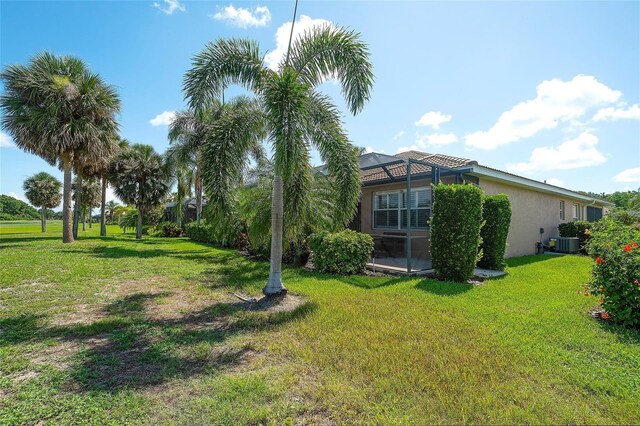 362 Fairway Isles Ln, Bradenton, FL 34212 - view of grassy yard with a lanai