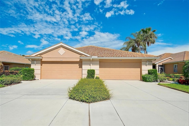 362 Fairway Isles Ln, Bradenton, FL 34212 - ranch-style home featuring stucco siding, driveway, a garage, and a tile roof