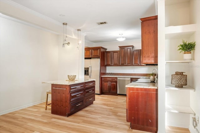 520 27th St W, Bradenton, FL 34205 - kitchen with dishwasher, fridge with ice dispenser, light wood finished floors, pendant lighting, and ornamental molding