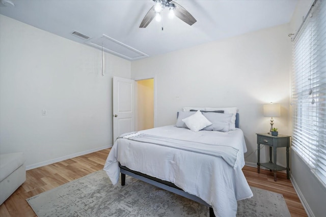 520 27th St W, Bradenton, FL 34205 - bedroom with attic access, wood finished floors, and ceiling fan