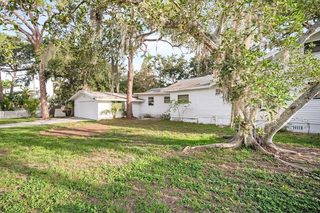 520 27th St W, Bradenton, FL 34205 - view of yard featuring driveway, an outdoor structure, and an attached garage