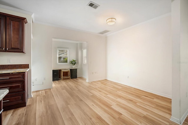 520 27th St W, Bradenton, FL 34205 - unfurnished living room with ornamental molding, light wood-style flooring, and a desk