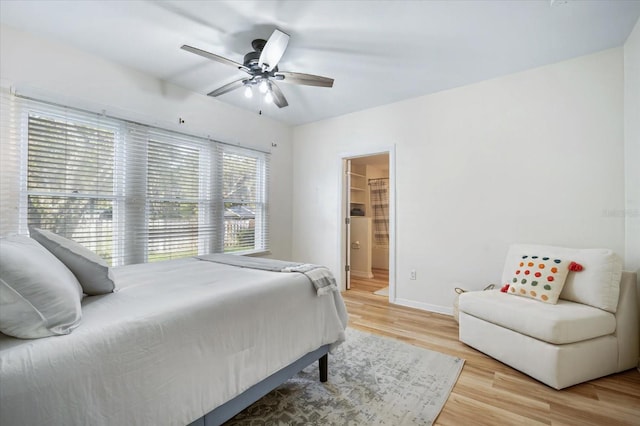 520 27th St W, Bradenton, FL 34205 - bedroom featuring light wood-style floors, ceiling fan, and connected bathroom
