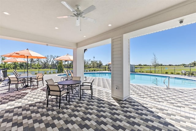4327 112th St E, Palmetto, FL 34221 - view of patio / terrace featuring a community pool and ceiling fan