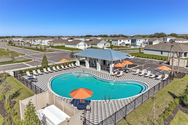 4327 112th St E, Palmetto, FL 34221 - community pool with a fenced backyard, a patio, and a residential view