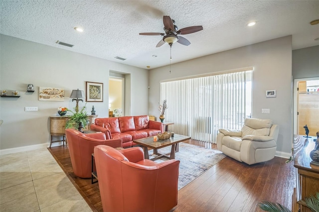 3041 Stonegate Falls Dr, Land O Lakes, FL 34638 - living room featuring ceiling fan, a textured ceiling, wood finished floors, and recessed lighting