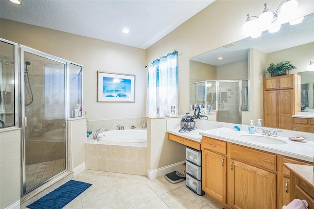3041 Stonegate Falls Dr, Land O Lakes, FL 34638 - full bath with vanity, tile patterned floors, a bath, a stall shower, and recessed lighting