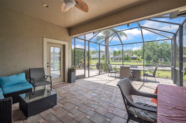 3041 Stonegate Falls Dr, Land O Lakes, FL 34638 - view of patio / terrace with a lanai, ceiling fan, and a residential view