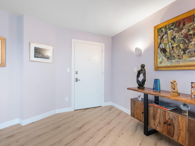 2295 Gulf Of Mexico Dr Unit 64S, Longboat Key, FL 34228 - entrance foyer with light wood finished floors and baseboards
