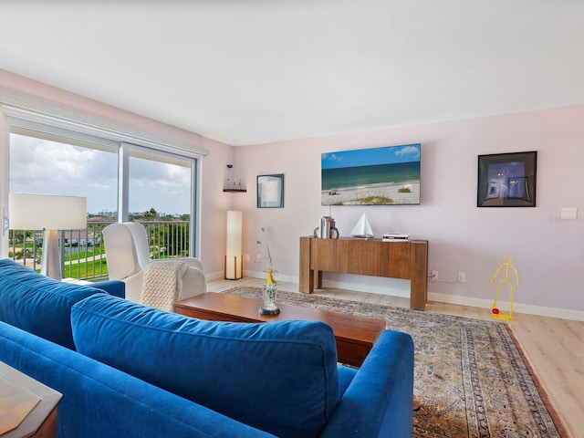 2295 Gulf Of Mexico Dr Unit 64S, Longboat Key, FL 34228 - living area featuring wood finished floors and baseboards