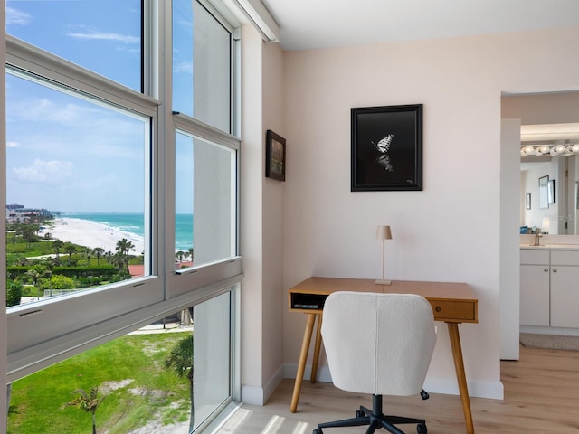 2295 Gulf Of Mexico Dr Unit 64S, Longboat Key, FL 34228 - office space featuring light wood-style flooring, healthy amount of natural light, and view of water and beach